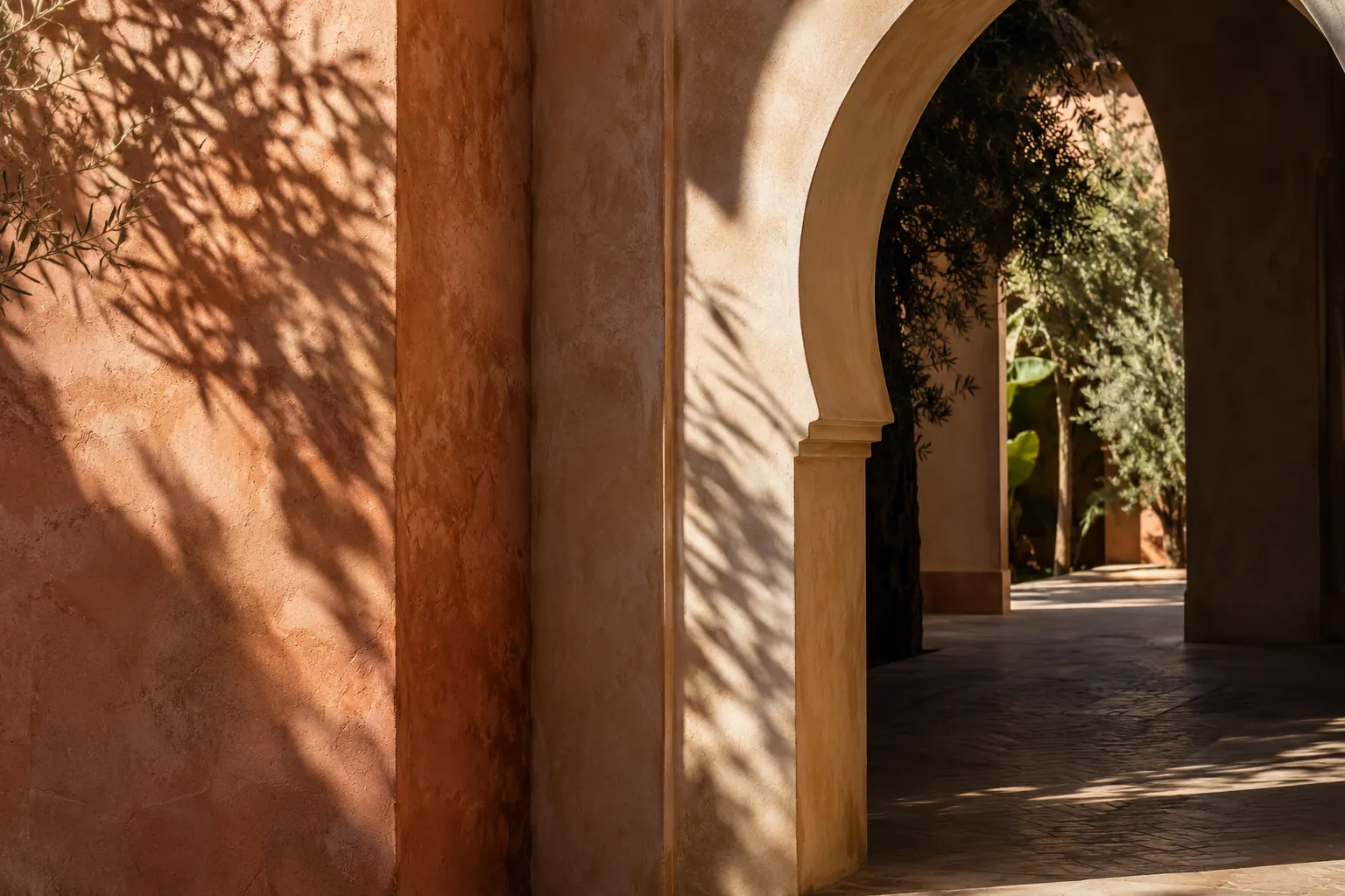 Quiet sunlit Marrakech archway and courtyard